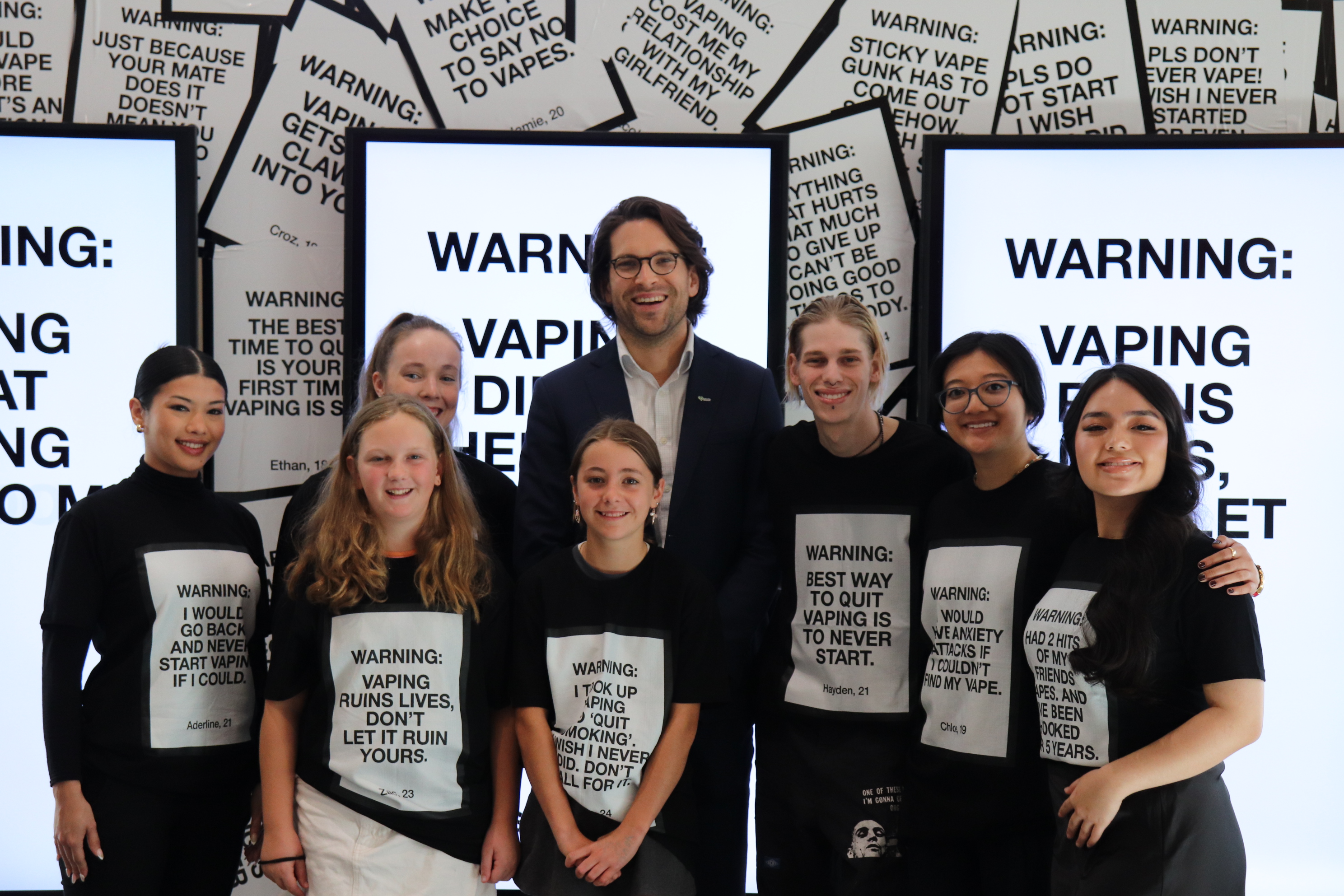 Young people who want to warn others about vaping pose for a photo with VicHealth CEO Dr Sandro Demaio