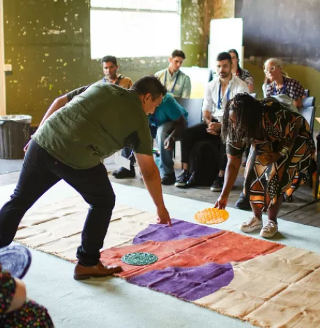A photo of people making art at a workshop